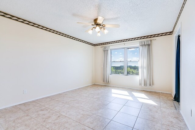 261 Edinburgh Rd, San Angelo, TX 76901 - spare room featuring light tile patterned floors, a textured ceiling, baseboards, and a ceiling fan