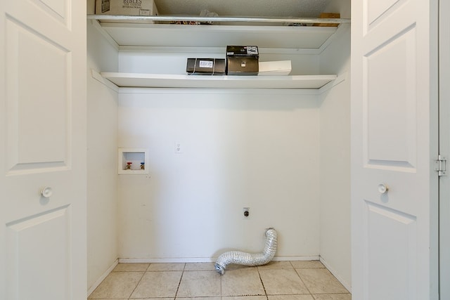 261 Edinburgh Rd, San Angelo, TX 76901 - laundry room featuring washer hookup, laundry area, and light tile patterned floors