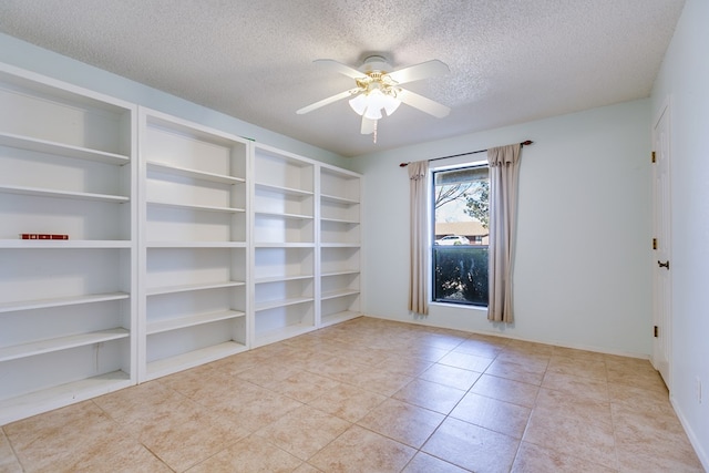 261 Edinburgh Rd, San Angelo, TX 76901 - tiled spare room with a textured ceiling, built in features, and a ceiling fan