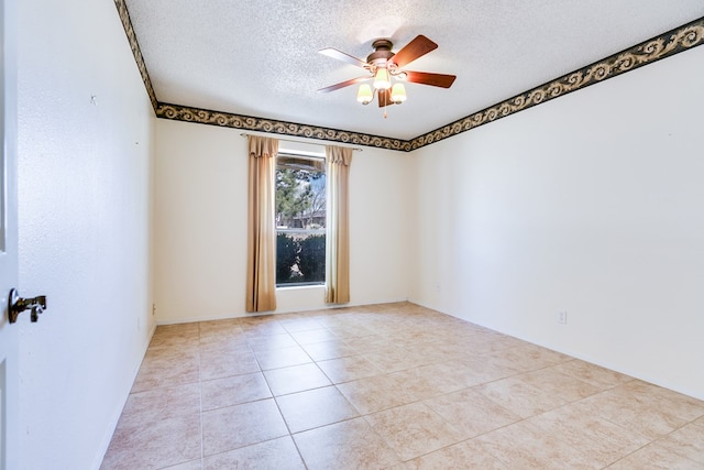 261 Edinburgh Rd, San Angelo, TX 76901 - empty room featuring a textured ceiling, tile patterned floors, and a ceiling fan