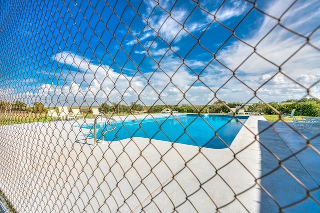 261 Edinburgh Rd, San Angelo, TX 76901 - outdoor pool featuring a patio and fence