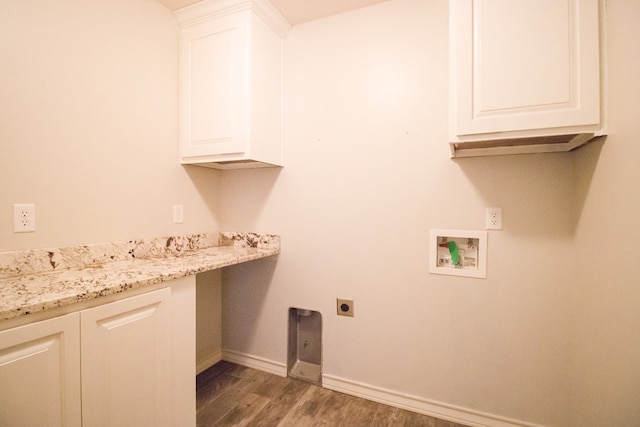5806 Willeke Dr, San Angelo, TX 76904 - laundry room with hookup for an electric dryer, wood finished floors, hookup for a washing machine, baseboards, and cabinet space