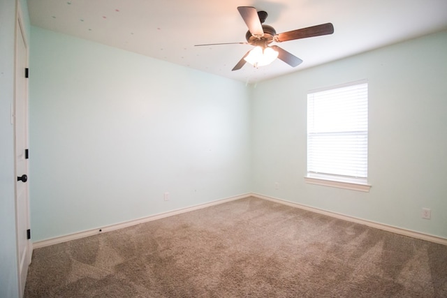 5806 Willeke Dr, San Angelo, TX 76904 - carpeted empty room featuring a ceiling fan and baseboards