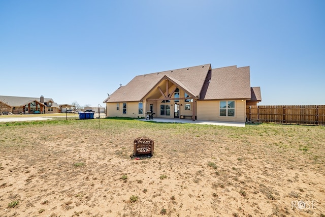 3504 Badger Ct, San Angelo, TX 76901 - back of property with a patio area and a fire pit