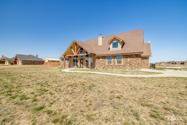 3504 Badger Ct, San Angelo, TX 76901 - view of front of house with a chimney and brick siding