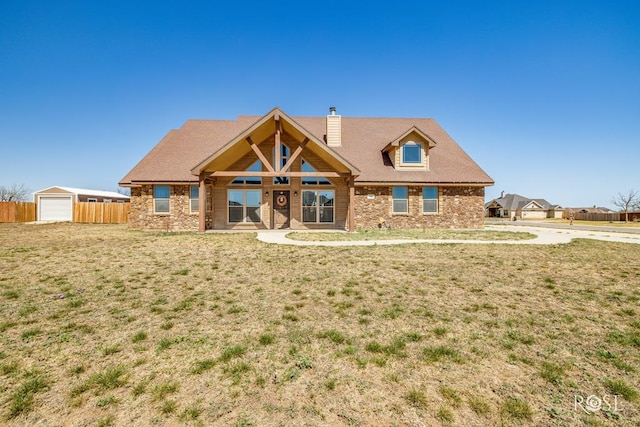 3504 Badger Ct, San Angelo, TX 76901 - view of front facade with a chimney and stone siding
