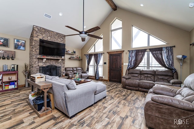 3504 Badger Ct, San Angelo, TX 76901 - living room featuring beamed ceiling, wood finished floors, high vaulted ceiling, ceiling fan, and a fireplace