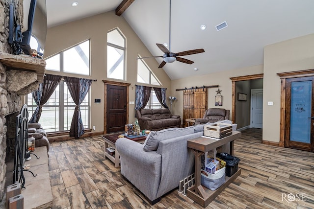 3504 Badger Ct, San Angelo, TX 76901 - living area with wood finished floors, high vaulted ceiling, beam ceiling, a ceiling fan, and baseboards