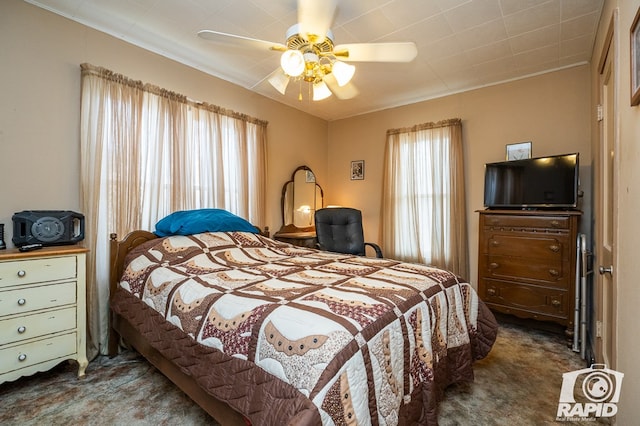 carpeted bedroom featuring ceiling fan