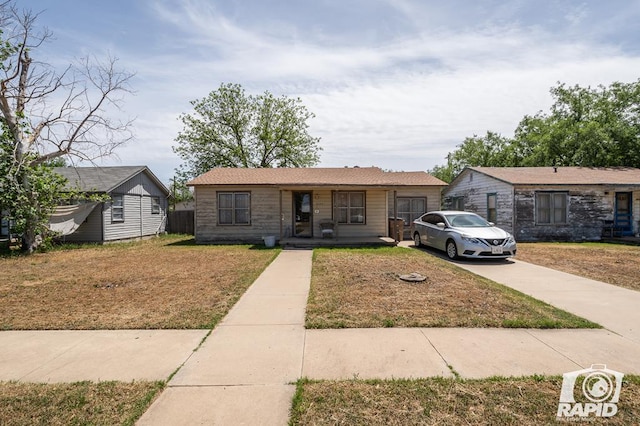 view of front of house featuring a front yard and a porch