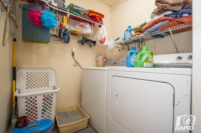 laundry room with washing machine and clothes dryer