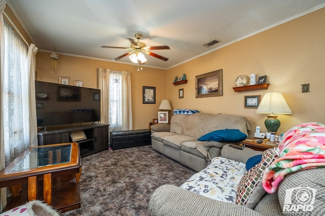 carpeted living room with crown molding and ceiling fan