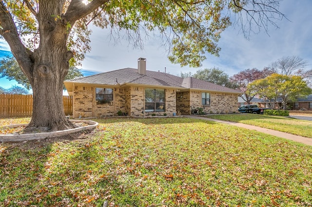 ranch-style house with a front lawn