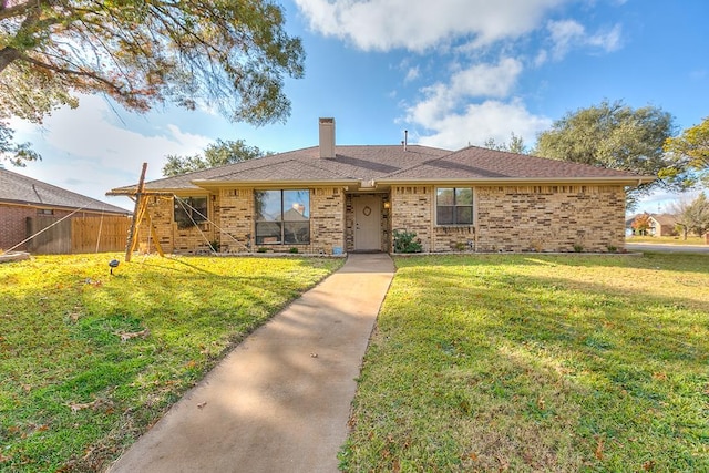 ranch-style home with a front lawn