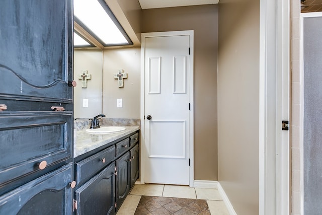 bathroom with vanity and tile patterned flooring