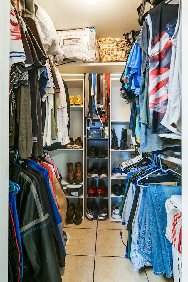 spacious closet with tile patterned floors