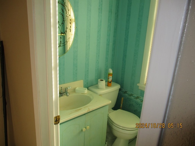 bathroom with vanity and toilet