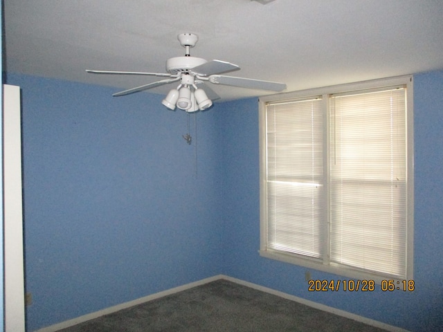 spare room with carpet flooring and ceiling fan