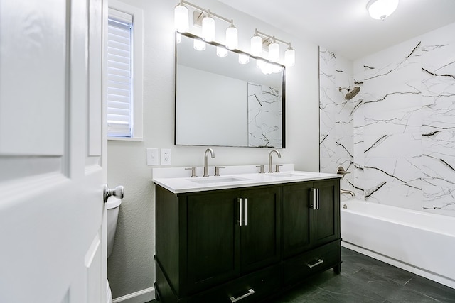 full bathroom with tiled shower / bath, vanity, and toilet