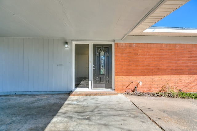 property entrance with a patio area