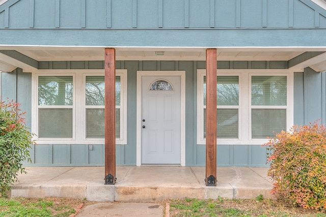 doorway to property featuring a porch