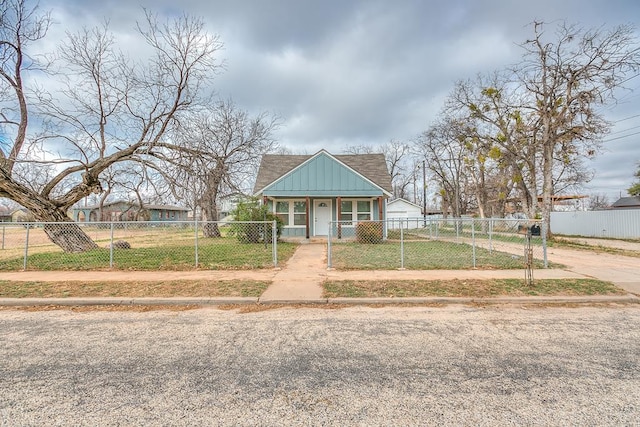 bungalow-style house with a front yard