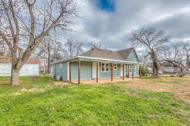 exterior space with a front yard and covered porch