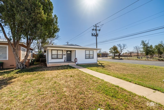 bungalow-style house with a porch and a front lawn