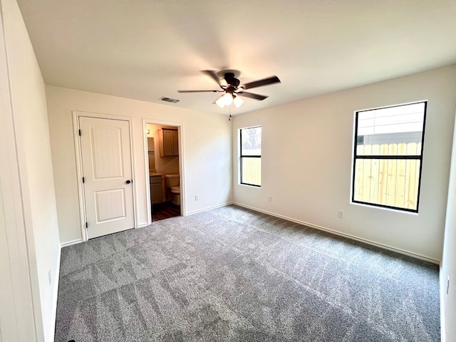 317 E 25th St, San Angelo, TX 76903 - unfurnished bedroom featuring carpet, ensuite bathroom, and ceiling fan