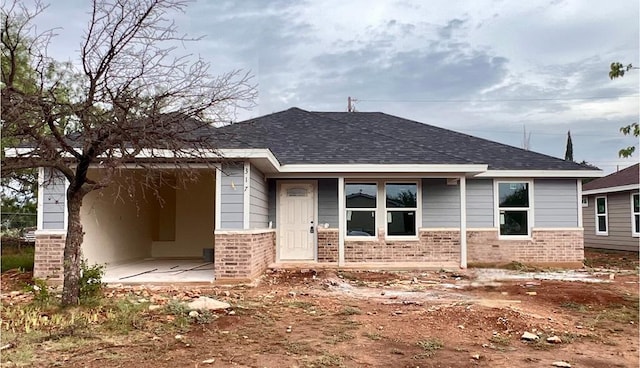 317 E 25th St, San Angelo, TX 76903 - single story home featuring roof with shingles and brick siding