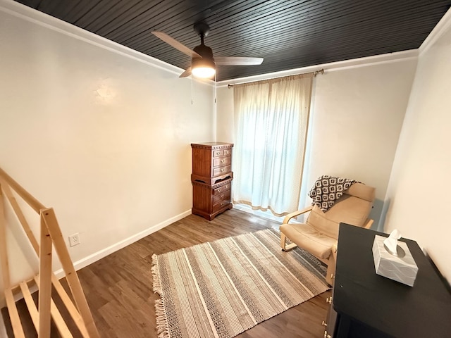 1702 Ellis St, San Angelo, TX 76905 - sitting room featuring crown molding, baseboards, wood finished floors, and ceiling fan