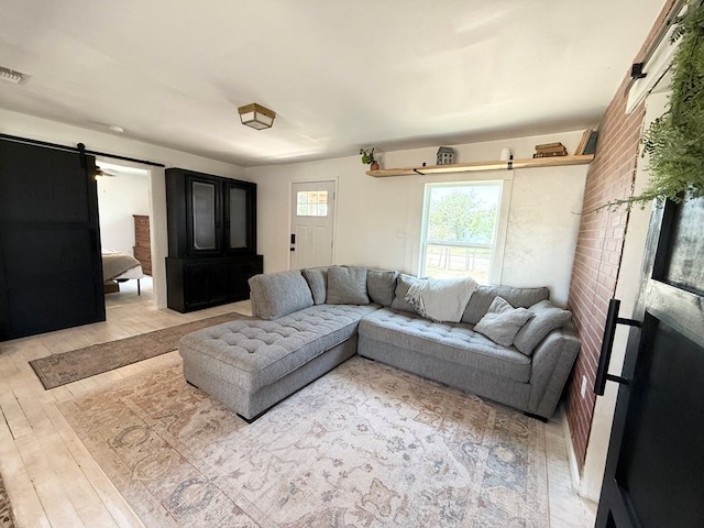 1702 Ellis St, San Angelo, TX 76905 - living area with a barn door and wood-type flooring