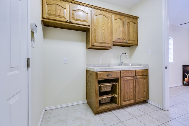 kitchen with sink and light tile patterned floors