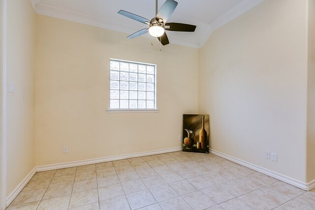 empty room with ceiling fan, ornamental molding, and light tile patterned floors