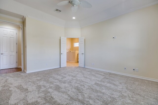 unfurnished bedroom featuring crown molding, ceiling fan, and light colored carpet