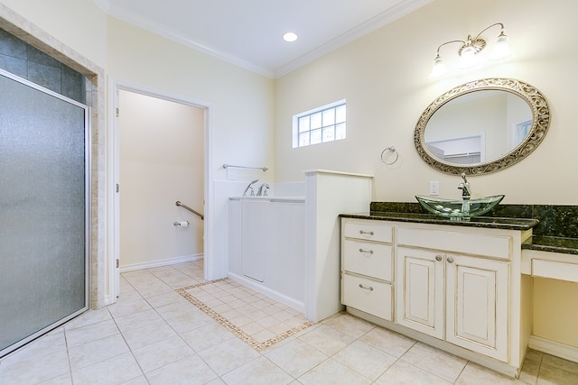 bathroom featuring tile patterned flooring, vanity, crown molding, and a shower with shower door