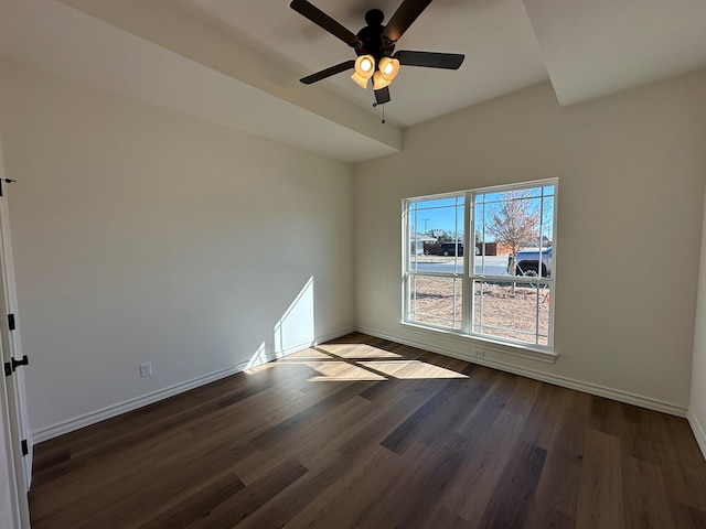 empty room featuring ceiling fan and dark hardwood / wood-style flooring