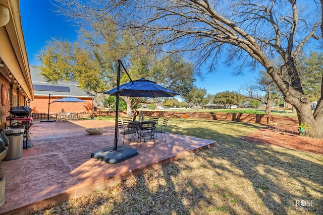 view of yard with a patio and fence