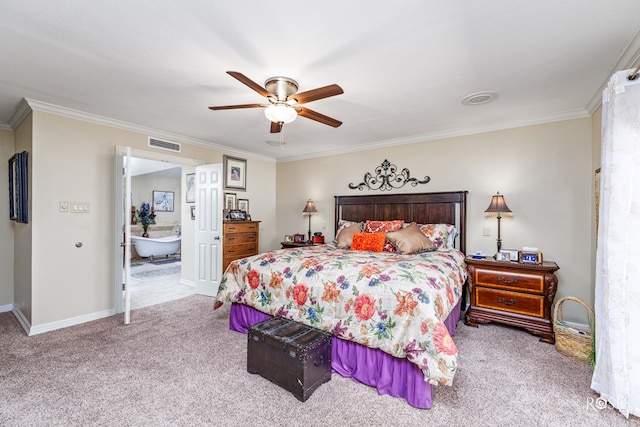 carpeted bedroom featuring baseboards, visible vents, a ceiling fan, ornamental molding, and ensuite bathroom