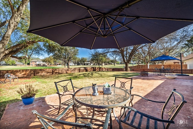 view of patio with fence and outdoor dining area