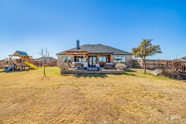 back of property featuring a yard, a playground, a fenced backyard, and a patio area