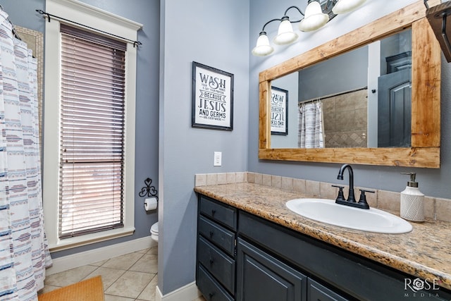 full bathroom with vanity, a shower with curtain, baseboards, tile patterned floors, and toilet