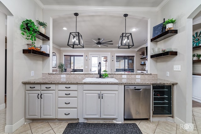 kitchen featuring a sink, ornamental molding, dishwasher, and open shelves