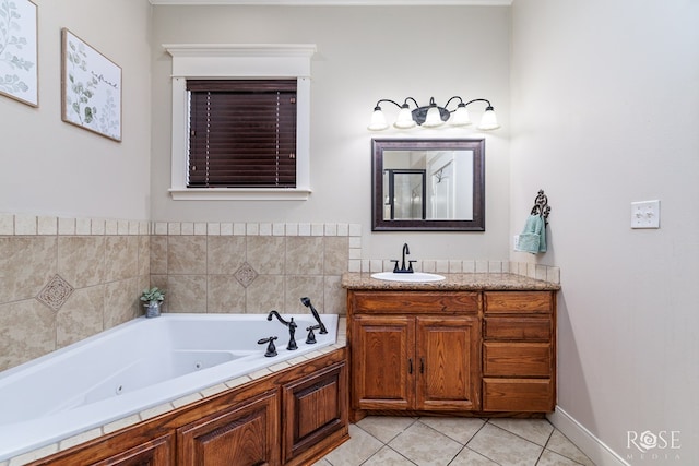 bathroom featuring tile patterned flooring, vanity, and a whirlpool tub