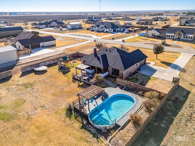 view of pool with a fenced in pool, a fenced backyard, and a residential view