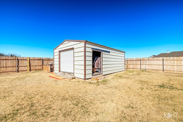 view of shed with a fenced backyard