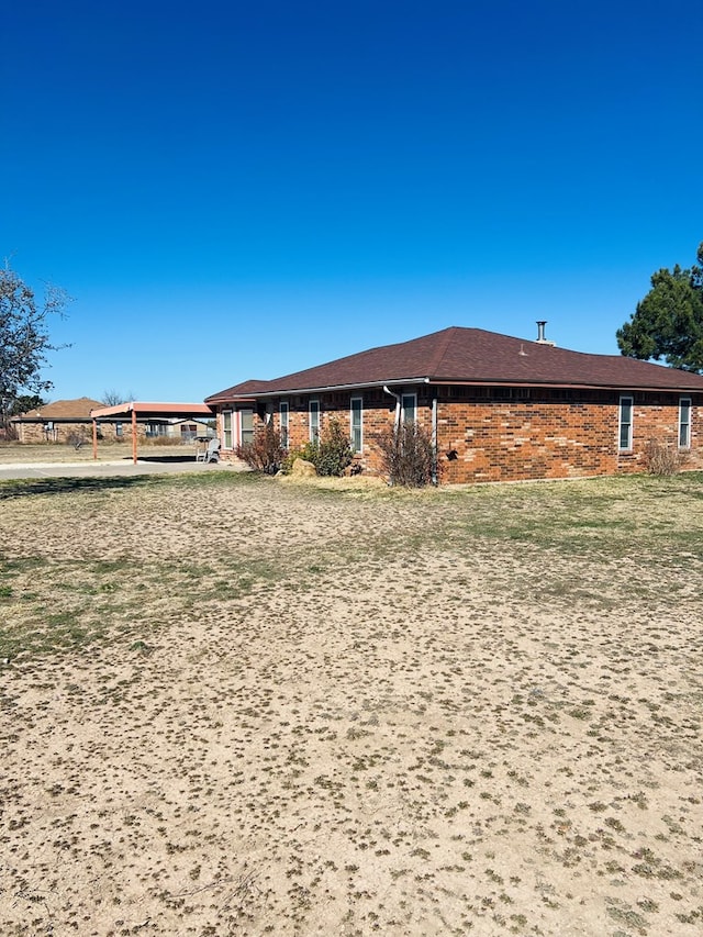 exterior space featuring brick siding