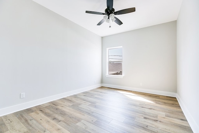 empty room featuring ceiling fan and light hardwood / wood-style floors