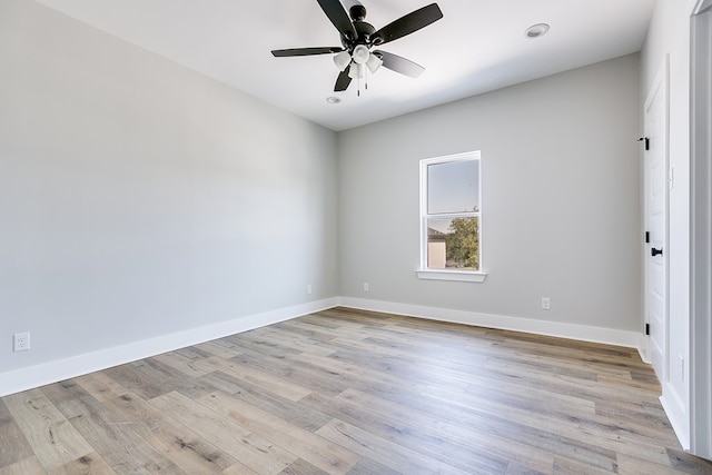 unfurnished room featuring light hardwood / wood-style floors and ceiling fan