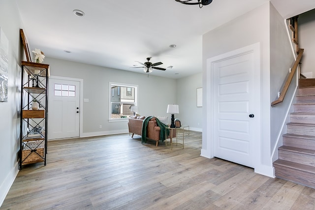 entryway with ceiling fan and light hardwood / wood-style flooring